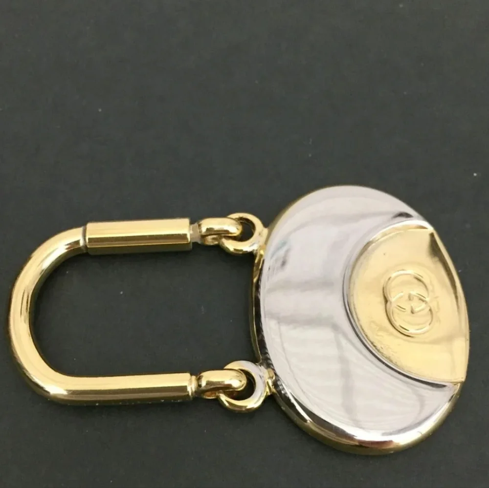 GUCCI INTERLOCKING G SILVER GOLD TONE KEY RING CHARM/UT1930 (UNISEX).